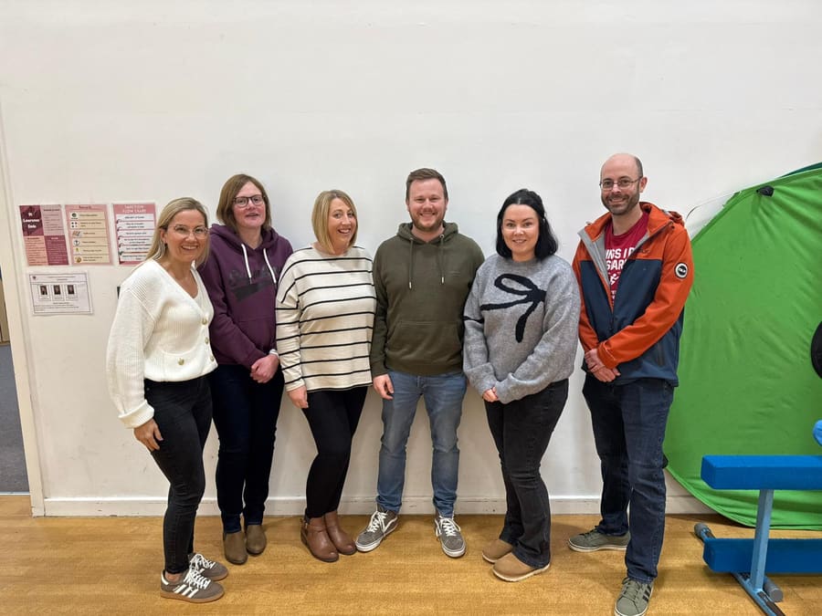 The six members of the PSFA committee standing together in the school hall